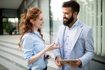 Business partners workmate couple talking in an urban city