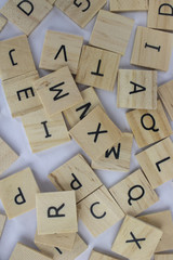 Wooden tiles with letters on an isolated white background