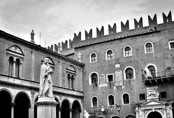 The marble statue of the famous medieval writer and poet Dante Alighieri in Verona, Italy; photos in antique black and white style - 205181165