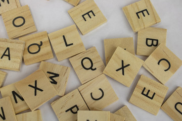 Wooden tiles with letters on an isolated white background