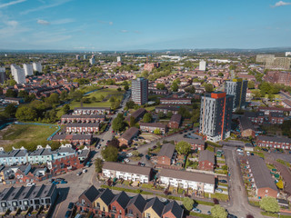 Obraz premium Aerial city centre drone above buildings british manchester skyline summer blue sky ancoats northern quarter