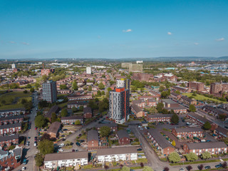 Aerial city centre drone above buildings british manchester skyline summer blue sky ancoats northern quarter