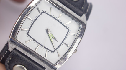 A man's wrist watch on an isolated white background 