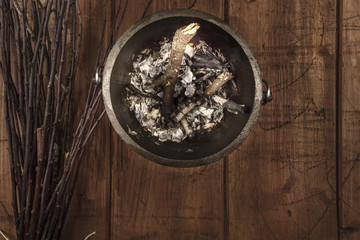 Overhead photo of witch's cauldron with broom and copy space