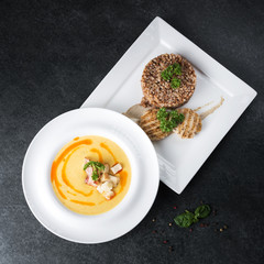 Complex dinner. Buckwheat porridge with dietary meat on a white plate is tenderly served