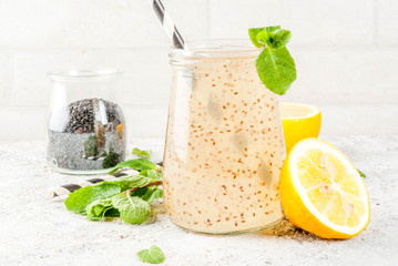 Natural energy drink, Chia fresca, infused water or lemonade on grey stone table copy space