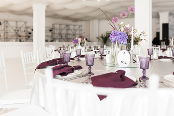 Photo of beautiful table setting at wedding hall isolated