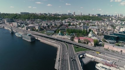 4K Aerial drone fooage. Marathon running on the bridge. Wide shot. View on podil in kiev