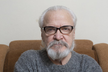 Lonely old man with sore eyes
