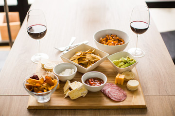Appetizer spread happy hour wine hummus meat cheese plate