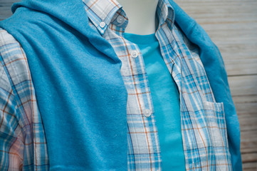 closeup of blue summer shirt on mannequin in fashion store for men