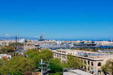 Aerial Panorama view of Barcelona city skyline over Passeig de Colom or Columbus avenue and Port Vell marina