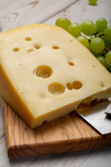 Dutch hard cheese Maasdam or Emmentaler, cheese with holes