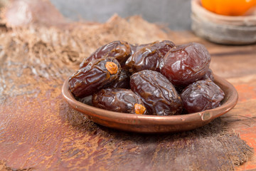 Traditional Middle East dessert, healthy food, big medjool dates fruits.