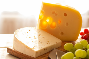 Dutch hard cheese Maasdam or Emmentaler, cheese with holes