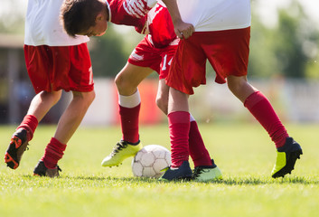 Young children players football match on soccer field