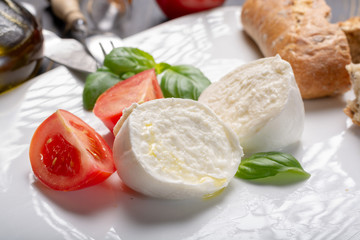 Traditional italian food - white ball mozzarella buffalo Italian soft cheese with cheese knife,...