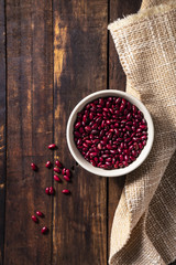 Red Kidney Beans in a bowl. Brown background.