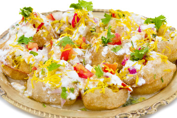 Indian Sweet And Spicy Chaat item Dahi Puri Also Called Dahi Batata Puri, Golgappe, Dahi Bhalle, Gol Gappa or Dahipuri Stuffed With Potato, Yogurt, Sev, Coriander, Chutney isolated on White Background