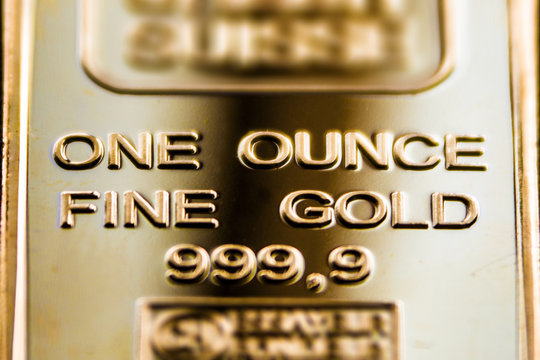 A Fragment Of A Gold Bar Is One Ounce.