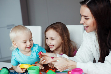 Mother playing with children