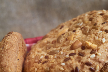 closeup oat large biscuits with sesame, flax and sunflower seeds. Macro