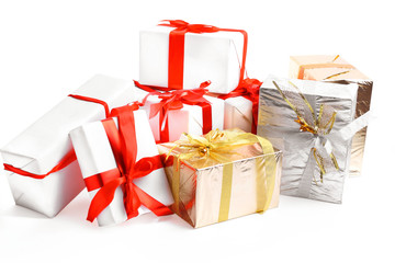 Holiday gift boxes decorated with ribbon isolated on white background