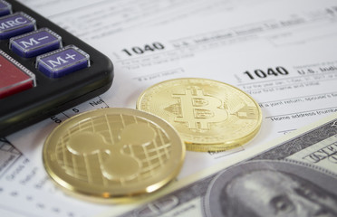 Bitcoin pile and alternate cryptocurrencies coin and calculator laying on 1040 tax form and dollar bills. Fees and taxes for cryptocurrencies investments concept.