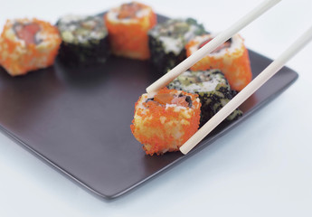 closeup.sticks and a set of Sushi rolls