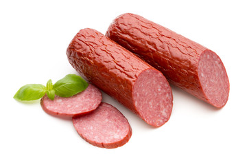 Salami smoked sausage, basil leaves on white background cutout.