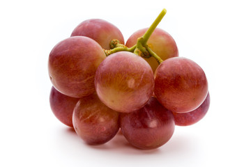 Ripe red grape isolated on white.
