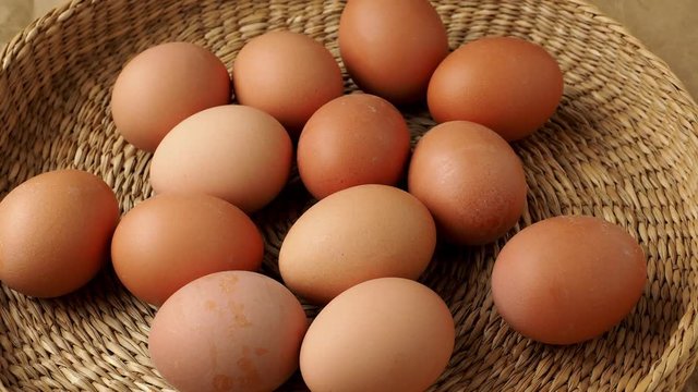 Brown eggs in the basket. Dietary products. Organic fresh eggs.