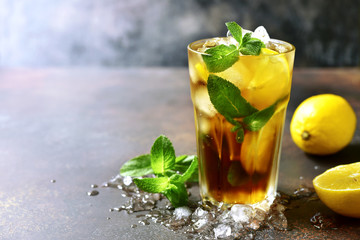 Coold summer cocktail long island or iced tea with lemon.