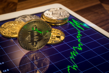 Cryptocurrency Bitcoin with green price market graph.