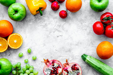 fruits and vegetables for healthy dinner on stone background top