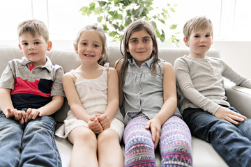 Group Of Young Friends Together on the sofa listening tv