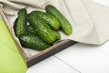 Bio cucumber in wooden box.