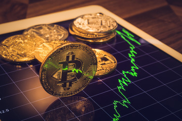 Bitcoin sign light reflect of price market graph.