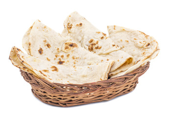 Indian Cuisine Tandoori Roti Served in Basket Also Called Chapati, Flatbread, Naan or Nan Bread on White Background