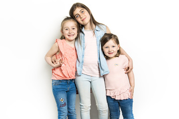 Obraz premium Sisters portrait in studio white background