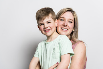 Mother and son on studio white background