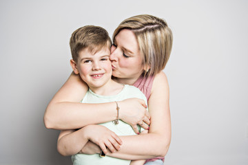 Mother and son on studio white background