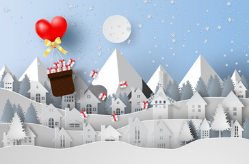 Paper art and craft of Merry Christmas with ballon gift Float above cityscape concept,heart,snow ,landscape,vector