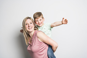 Mother and son on studio white background