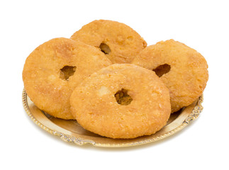 Indian Traditional Sweet Kachori Also Know As Mawa Kachori, Kachauri or Kachodi, Stuffed Kachori With Condensed Milk, Cheese and Dry Fruits And Served With Sugar Syrup isolated on White Background