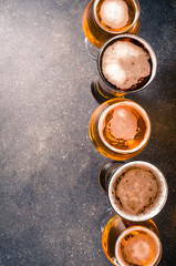 Beer glasses on dark table. Top view