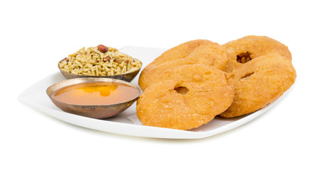 Indian Traditional Sweet Kachori Also Know As Mawa Kachori, Kachauri or Kachodi, Stuffed Kachori With Condensed Milk, Cheese and Dry Fruits And Served With Sugar Syrup isolated on White Background