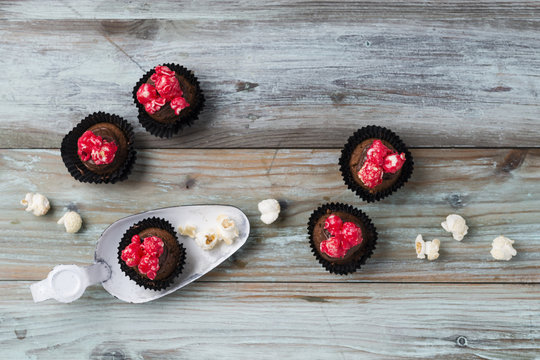 Homemade small cupcakes with colored marshmallow popcorn