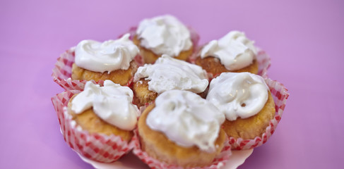Pink cupcake decorated on a blurred background