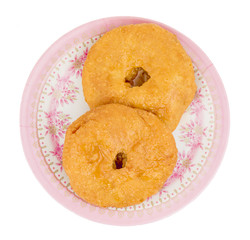 Indian Traditional Sweet Kachori Also Know As Mawa Kachori, Kachauri or Kachodi, Stuffed Kachori With Condensed Milk, Cheese and Dry Fruits And Served With Sugar Syrup isolated on White Background